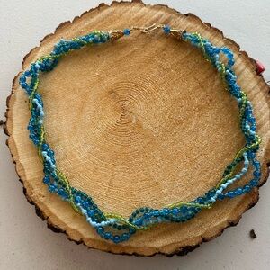 Four strand permanent twist seed bead necklace and greens and blues